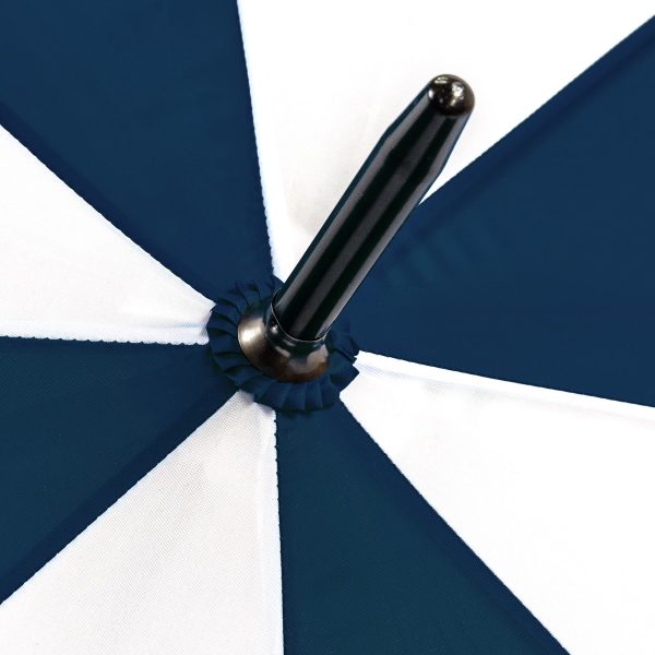 Close-up of a navy and white X-brella umbrella with a black handle.