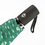 Green compact umbrella with white cloud pattern and black handle.